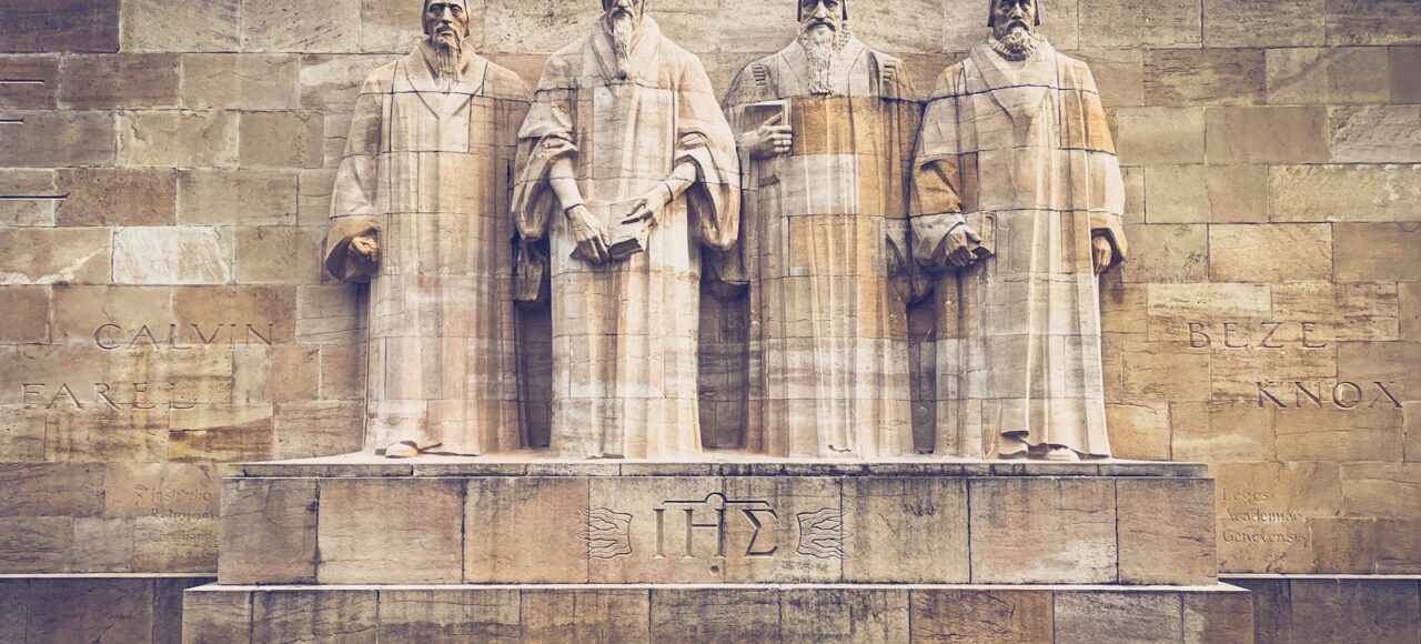 a group of statues of men standing next to each other